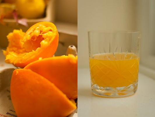 A composite image: on the left, the vibrant discarded remnants of squeezed oranges; on the right, a cut-glass tumbler of fresh orange juice