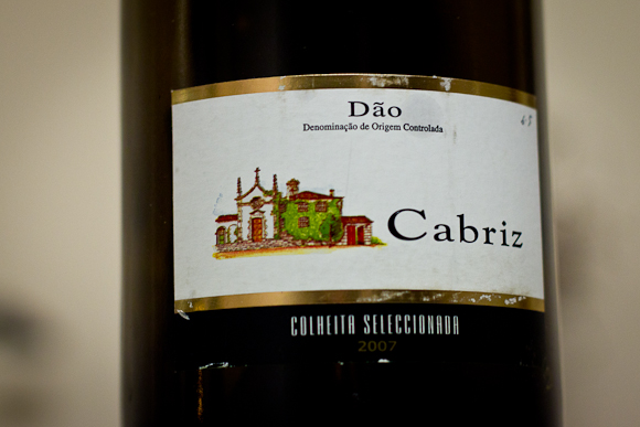 Label of a bottle of Portugese red wine produced by Cabriz. The label is relatively plain with a simple illustration of a building