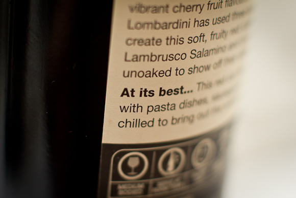A macro shot of the text written on the back of a bottle of red wine from Marks & Spencer