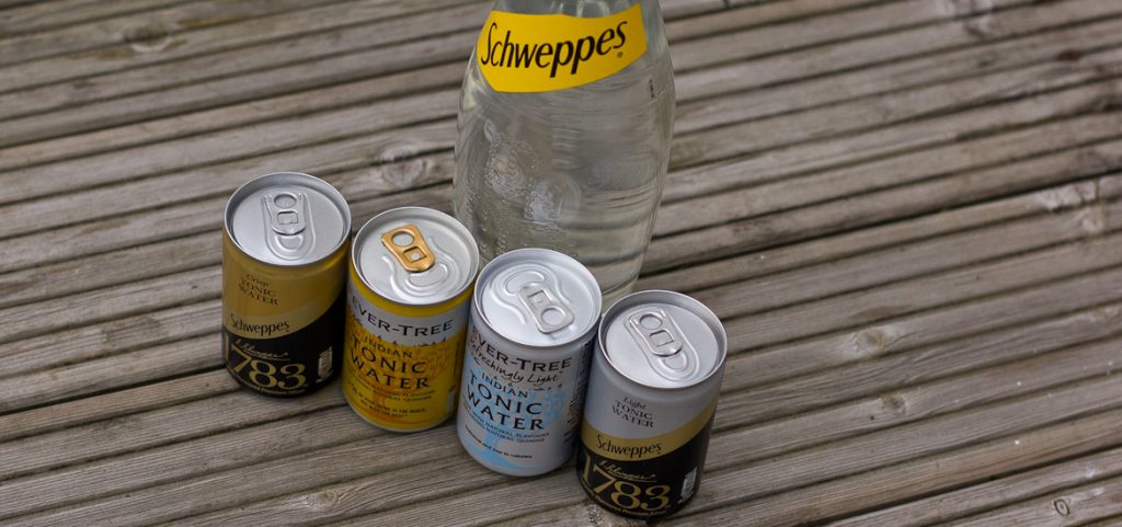 Four tonic water mini cans (Fever Tree and Schweppes 1783) plus a big bottle of Schweppes regular tonic